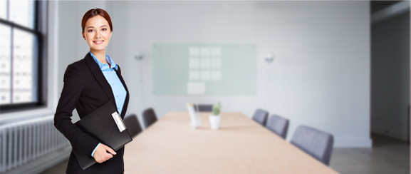 A professional woman standing in a boardroom